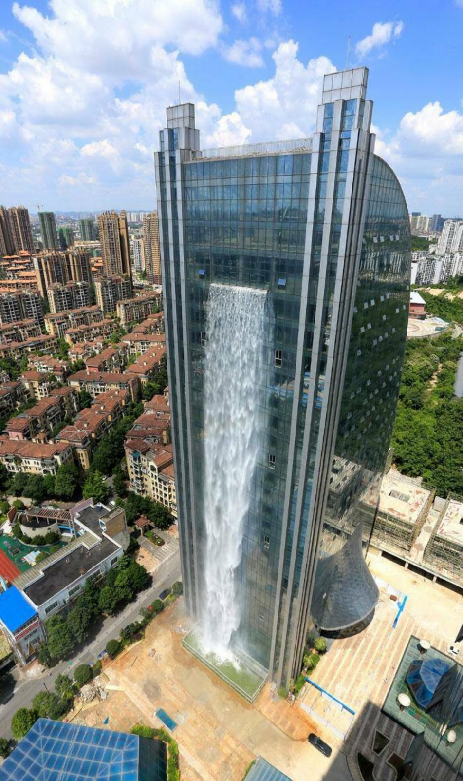 350' (121 metres) high artificial waterfall on the facade of the Liebian International Building in Guiyang in China's southwestern Guizhou province