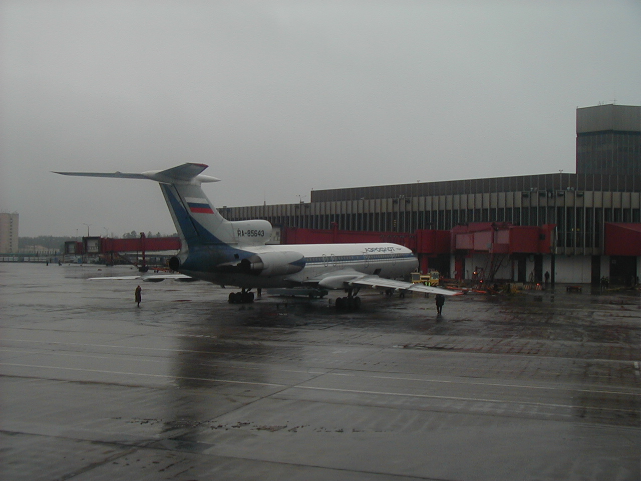 Aboard Aeroflot Boeing B767, passing parked Aeroflot Tupolev 154 airliner at Terminal 2, while taxiing out for takeoff from Moscow's Sheremetyevo Airport in Russia