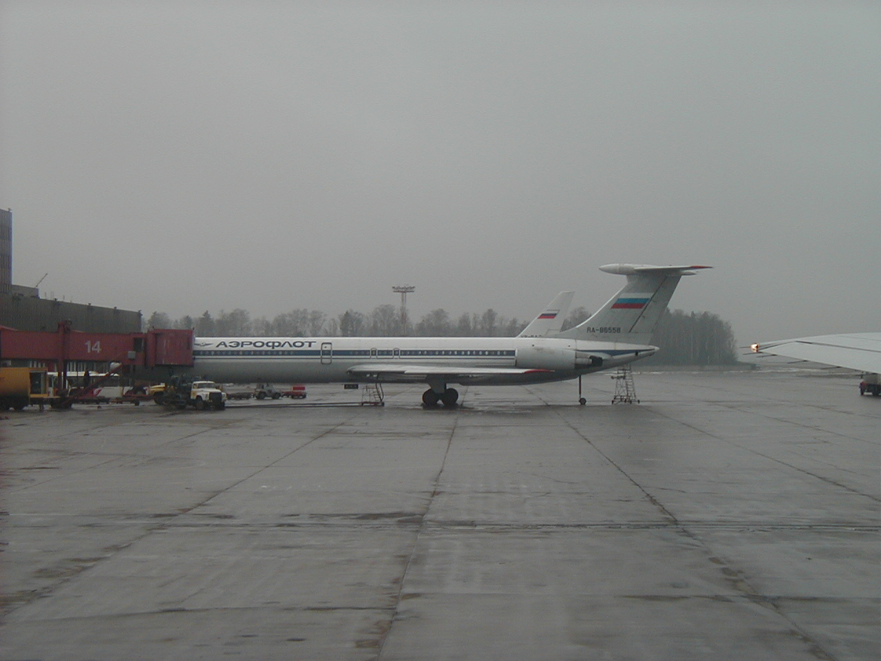 Aboard Aeroflot Boeing B767, passing parked Aeroflot Ilyushin Il-62M airliner at Terminal 2, while taxiing out for takeoff from Moscow's Sheremetyevo Airport in Russia
