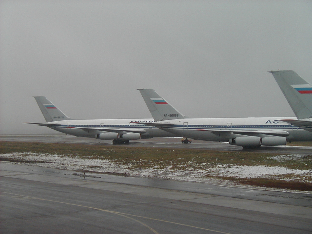 Aboard Aeroflot Boeing B767, passing 3 parked Aeroflot Ilyushin Il-86 airliners, while taxiing out for takeoff from Moscow's Sheremetyevo Airport in Russia