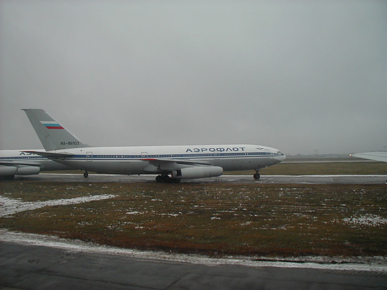 Aboard Aeroflot Boeing B767, passing 2 parked Aeroflot Ilyushin Il-86 airliners, while taxiing out for takeoff from Moscow's Sheremetyevo Airport in Russia